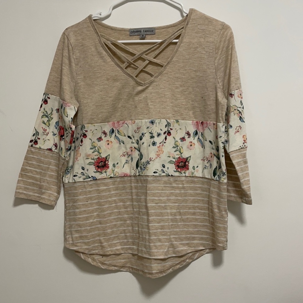 Medium sized nude floral/stripped Top